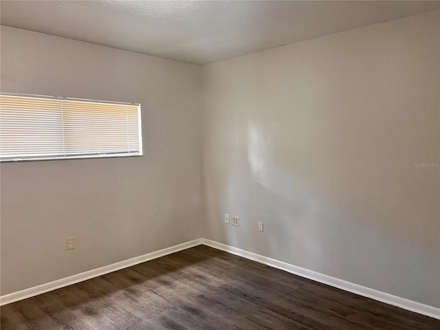 132 Mckean St Unit A, B, Auburndale, FL 33823 - unfurnished room with dark wood-style flooring and baseboards
