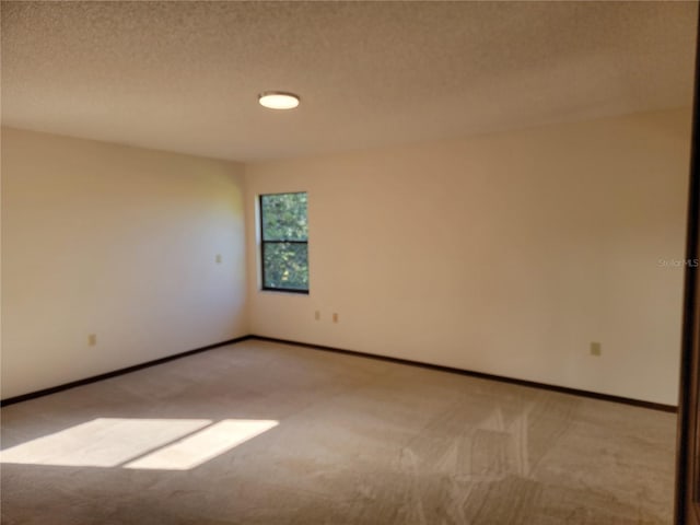 1842 Pinnacle Dr, Lakeland, FL 33813 - spare room featuring carpet and a textured ceiling