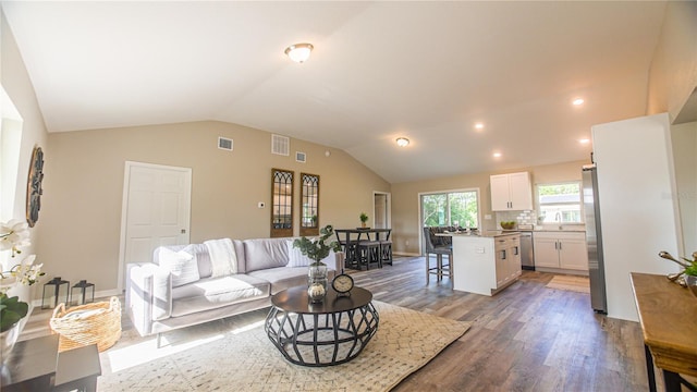 6262 NW 61st St, Ocala, FL 34482 - living room with vaulted ceiling, wood finished floors, and recessed lighting