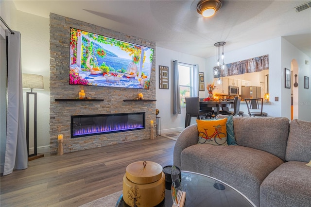 243 Palermo St, Davenport, FL 33897 - living area with wood finished floors and a fireplace