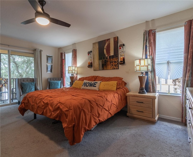 243 Palermo St, Davenport, FL 33897 - carpeted bedroom with access to exterior, multiple windows, and ceiling fan