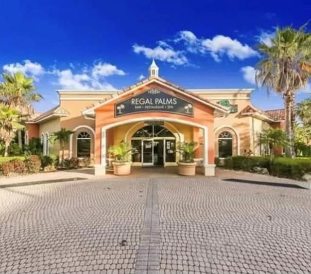 243 Palermo St, Davenport, FL 33897 - view of building exterior featuring curved driveway