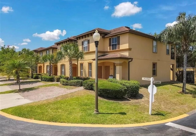 243 Palermo St, Davenport, FL 33897 - view of front of property featuring stucco siding and a front lawn