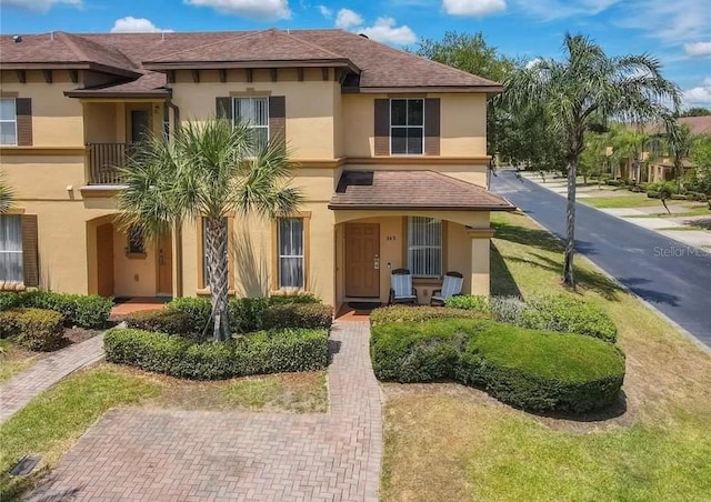 243 Palermo St, Davenport, FL 33897 - view of front of house with stucco siding and roof with shingles
