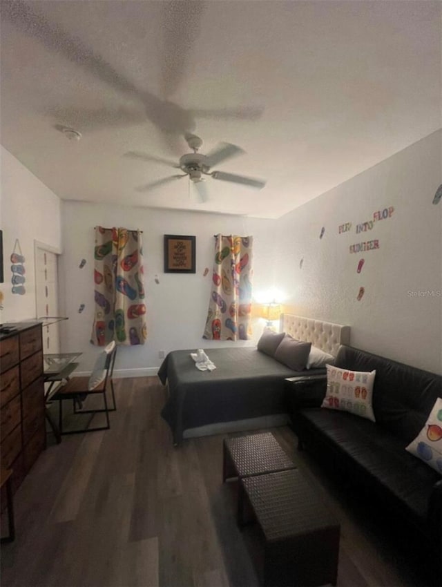 243 Palermo St, Davenport, FL 33897 - bedroom with wood finished floors, a ceiling fan, and a textured ceiling