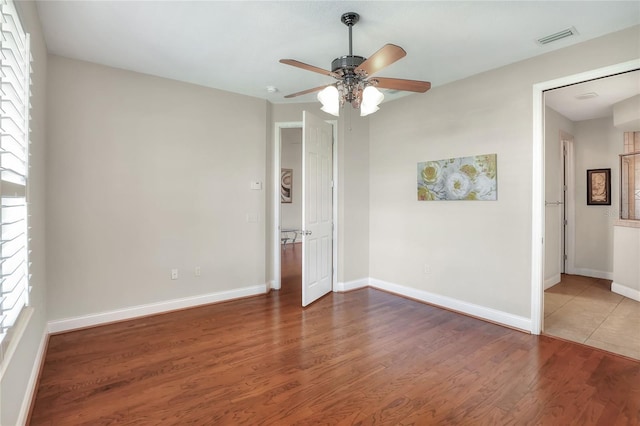 2929 Mission Lakes Dr Unit 10, Lakeland, FL 33803 - empty room featuring ceiling fan and wood finished floors
