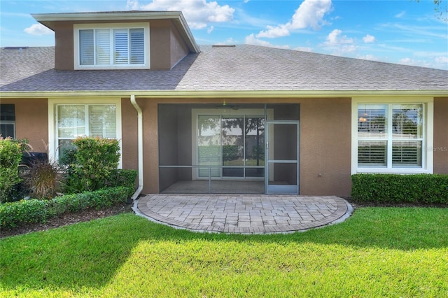 2929 Mission Lakes Dr Unit 10, Lakeland, FL 33803 - back of property featuring stucco siding, a yard, and a patio area