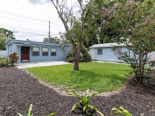 1420 S Lincoln Ave, Lakeland, FL 33803 - view of green lawn with a patio area