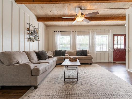 1420 S Lincoln Ave, Lakeland, FL 33803 - living area with wood finished floors, healthy amount of natural light, a wooden ceiling with exposed beams, and ceiling fan