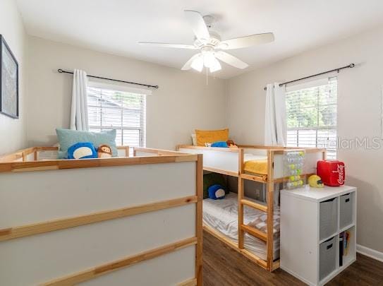 1420 S Lincoln Ave, Lakeland, FL 33803 - bedroom with multiple windows, dark wood-style flooring, and ceiling fan