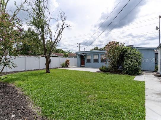 1420 S Lincoln Ave, Lakeland, FL 33803 - fenced backyard featuring a patio