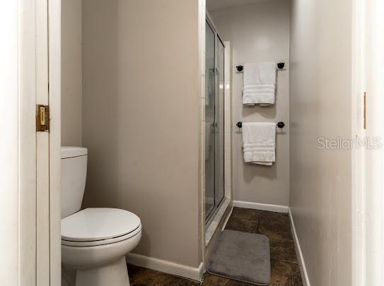 1420 S Lincoln Ave, Lakeland, FL 33803 - bathroom featuring a shower stall and tile patterned flooring