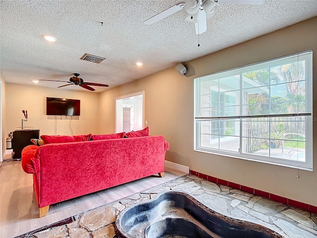 310 Keystone Rd, Auburndale, FL 33823 - living area featuring ceiling fan, wood finished floors, a textured ceiling, and recessed lighting