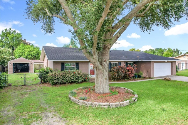 310 Keystone Rd, Auburndale, FL 33823 - ranch-style house featuring concrete driveway, an attached garage, and a shingled roof