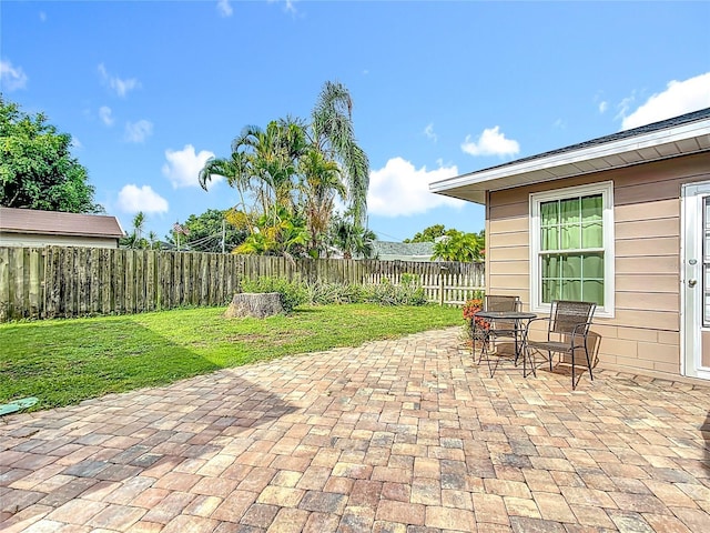 310 Keystone Rd, Auburndale, FL 33823 - fenced backyard with a patio area