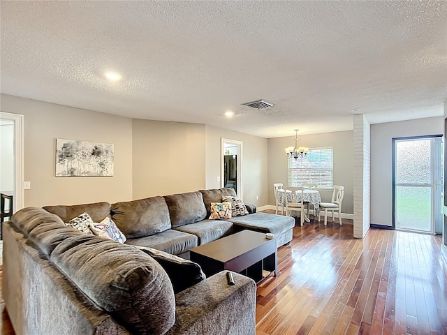 310 Keystone Rd, Auburndale, FL 33823 - living area featuring a textured ceiling, a chandelier, hardwood / wood-style flooring, and recessed lighting