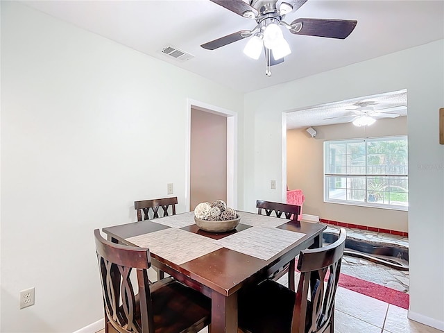 310 Keystone Rd, Auburndale, FL 33823 - dining area with ceiling fan and baseboards