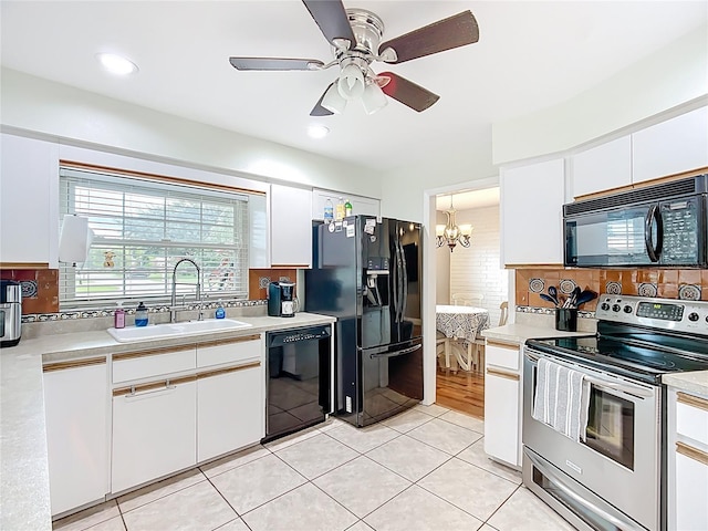 310 Keystone Rd, Auburndale, FL 33823 - kitchen featuring black appliances, white cabinetry, light countertops, a chandelier, and recessed lighting