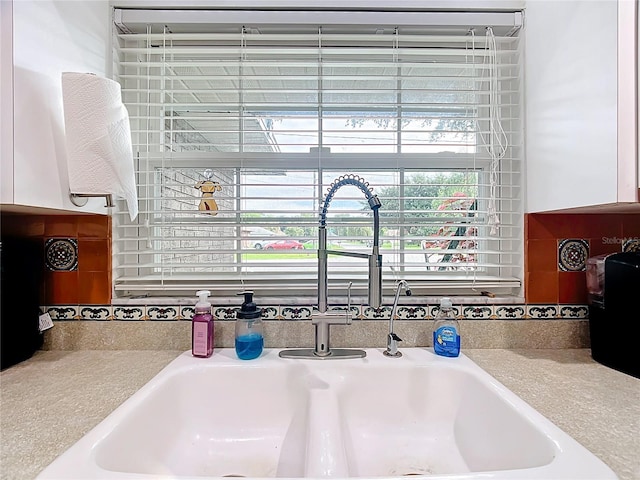 310 Keystone Rd, Auburndale, FL 33823 - kitchen view of a sink and white cabinets