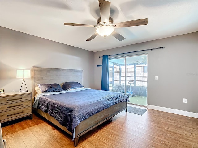 310 Keystone Rd, Auburndale, FL 33823 - bedroom with access to exterior, wood finished floors, and a ceiling fan
