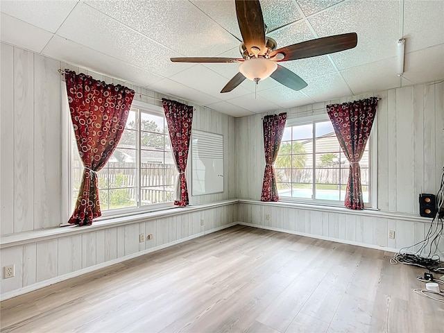 310 Keystone Rd, Auburndale, FL 33823 - unfurnished room with wood finished floors, ceiling fan, and wood walls