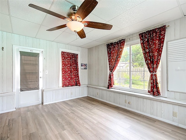 310 Keystone Rd, Auburndale, FL 33823 - unfurnished room with wood finished floors, ceiling fan, and wooden walls