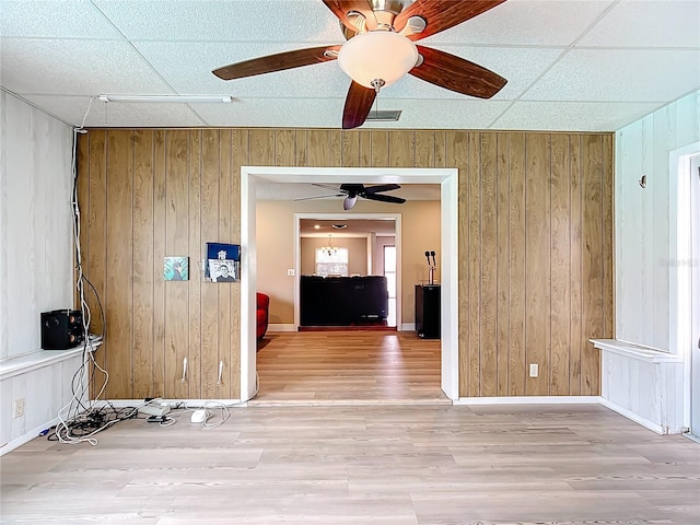310 Keystone Rd, Auburndale, FL 33823 - empty room with wood walls, wood finished floors, and ceiling fan