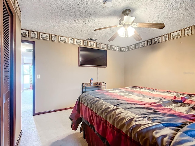 310 Keystone Rd, Auburndale, FL 33823 - carpeted bedroom featuring a textured ceiling and a ceiling fan