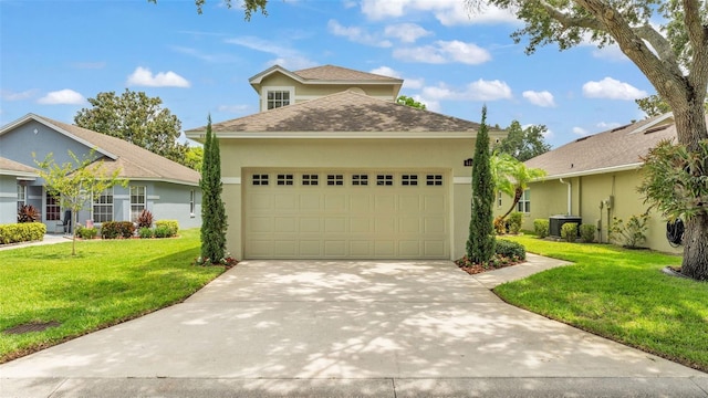 4445 Pebble Pointe Dr, Lakeland, FL 33813 - traditional home with a shingled roof, driveway, stucco siding, an attached garage, and a front yard