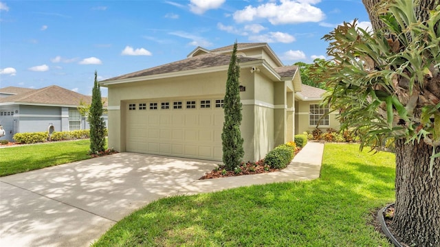 4445 Pebble Pointe Dr, Lakeland, FL 33813 - view of home's exterior with stucco siding, driveway, a garage, a lawn, and roof with shingles
