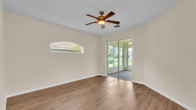 4445 Pebble Pointe Dr, Lakeland, FL 33813 - unfurnished room featuring wood finished floors and ceiling fan