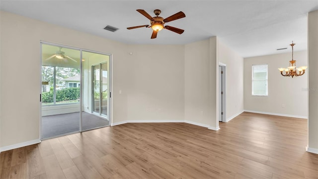 4445 Pebble Pointe Dr, Lakeland, FL 33813 - empty room with a ceiling fan, plenty of natural light, and wood finished floors