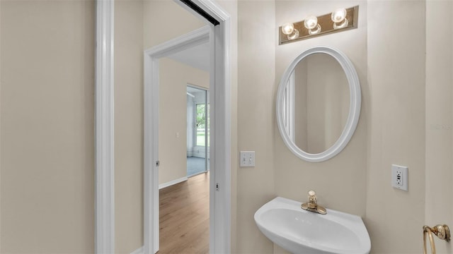 4445 Pebble Pointe Dr, Lakeland, FL 33813 - bathroom featuring a sink and wood finished floors