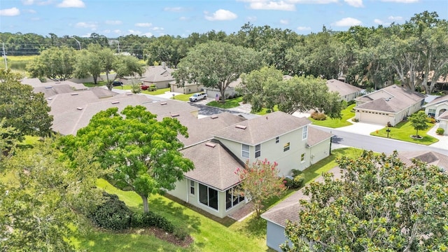 4445 Pebble Pointe Dr, Lakeland, FL 33813 - aerial perspective of suburban area with a tree filled landscape