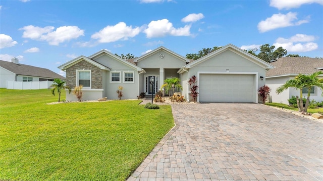 1095 Woodland Oaks Dr, Lakeland, FL 33813 - single story home featuring decorative driveway, stucco siding, an attached garage, and stone siding