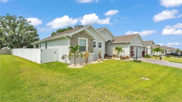 1095 Woodland Oaks Dr, Lakeland, FL 33813 - ranch-style house with stone siding, a garage, driveway, and stucco siding