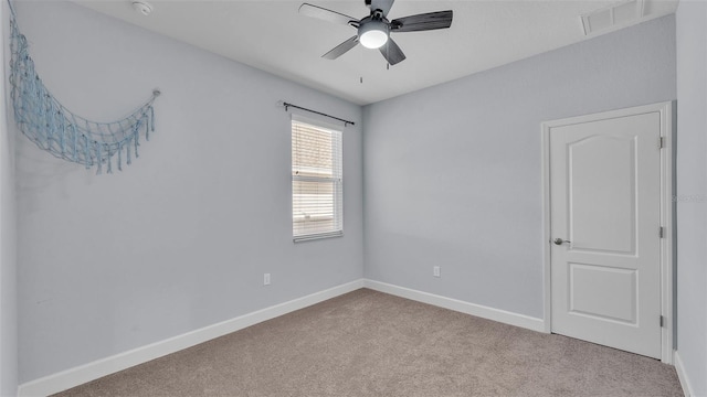 1095 Woodland Oaks Dr, Lakeland, FL 33813 - empty room featuring carpet, ceiling fan, and a smoke detector