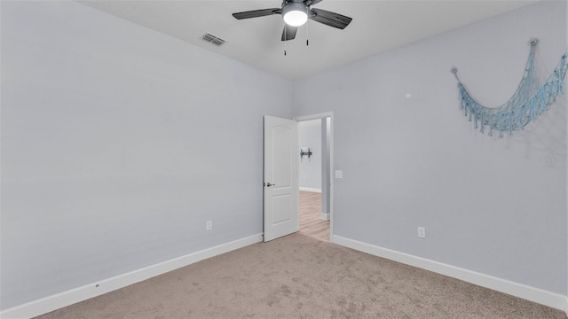 1095 Woodland Oaks Dr, Lakeland, FL 33813 - carpeted spare room with a ceiling fan and baseboards