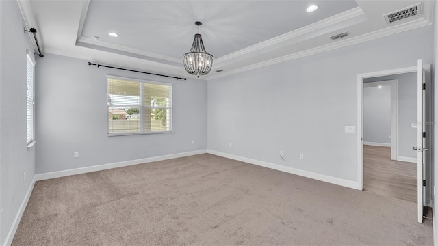 1095 Woodland Oaks Dr, Lakeland, FL 33813 - spare room with a tray ceiling, ornamental molding, a chandelier, carpet floors, and recessed lighting