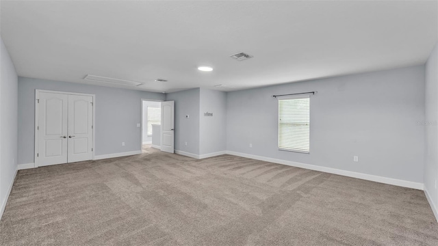 1095 Woodland Oaks Dr, Lakeland, FL 33813 - unfurnished bedroom with multiple windows and carpet floors