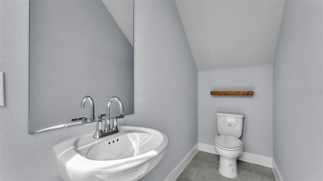 1095 Woodland Oaks Dr, Lakeland, FL 33813 - bathroom with lofted ceiling and tile patterned floors