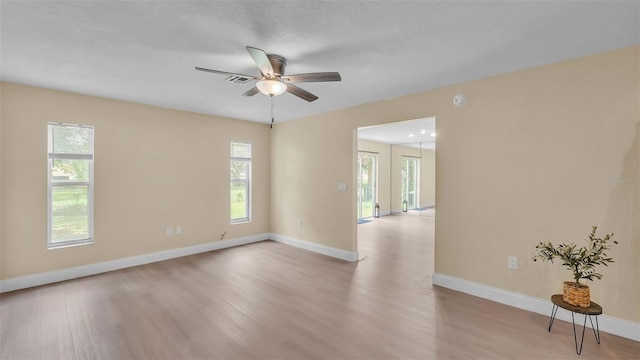 1100 Lowry Ave Unit 69, Lakeland, FL 33801 - empty room with light wood-style flooring, a ceiling fan, and a smoke detector