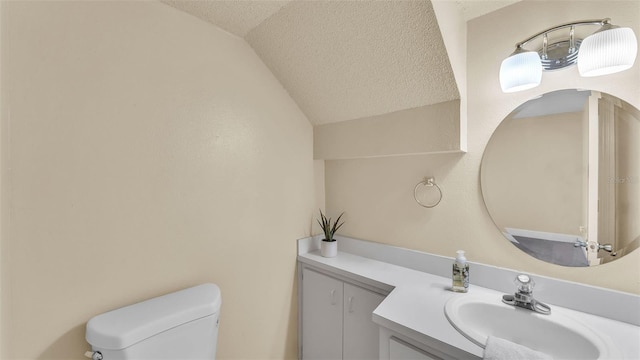 1100 Lowry Ave Unit 69, Lakeland, FL 33801 - half bathroom with vaulted ceiling, vanity, and a textured ceiling