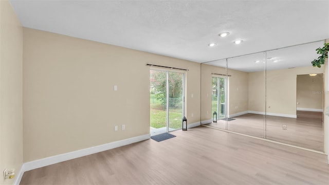 1100 Lowry Ave Unit 69, Lakeland, FL 33801 - empty room featuring light wood-style flooring and recessed lighting