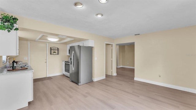 1100 Lowry Ave Unit 69, Lakeland, FL 33801 - kitchen featuring appliances with stainless steel finishes, light wood finished floors, white cabinetry, and light countertops