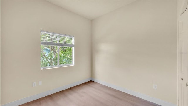 1100 Lowry Ave Unit 69, Lakeland, FL 33801 - spare room featuring baseboards and light wood-type flooring