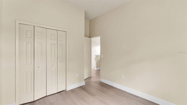 1100 Lowry Ave Unit 69, Lakeland, FL 33801 - unfurnished bedroom with wood finished floors and a closet