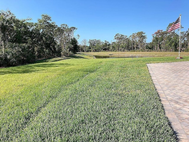 26005 Bimini Sands Ct, Englewood, FL 34223 - view of grassy yard featuring a water view