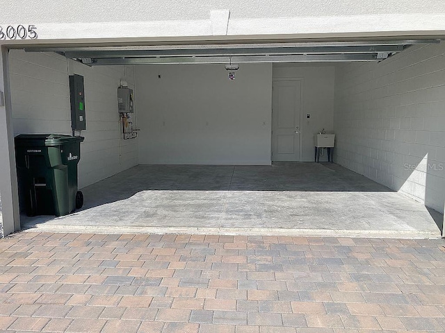 26005 Bimini Sands Ct, Englewood, FL 34223 - garage with electric panel and concrete block wall