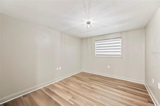 1231 Melville Ave, Lakeland, FL 33805 - spare room with light wood-type flooring and a textured ceiling